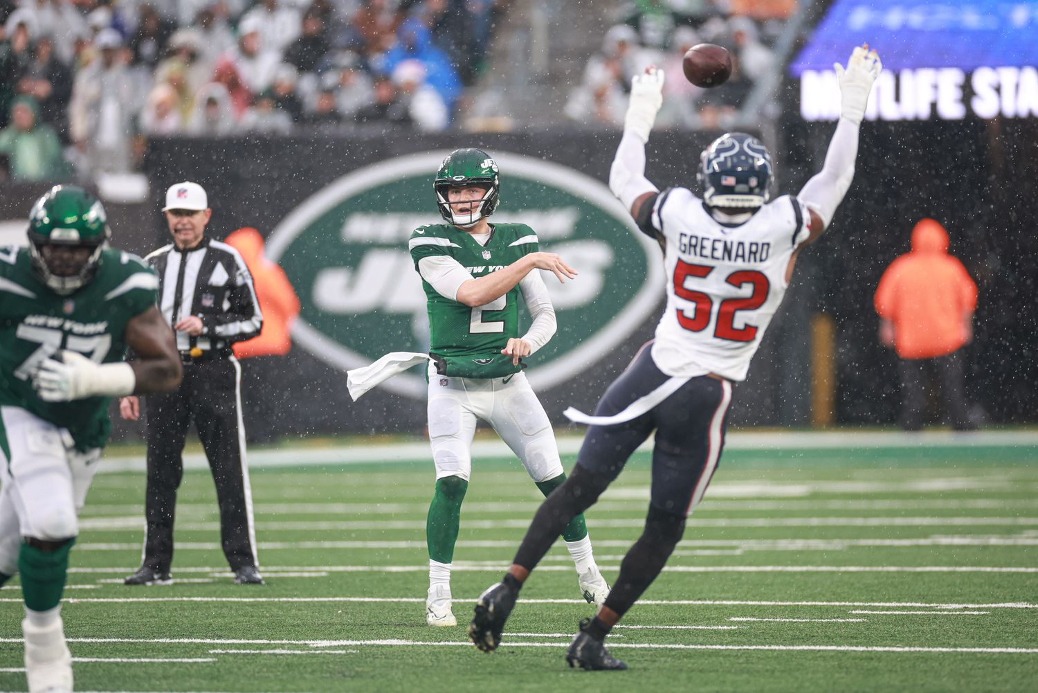 Jets' QB Zach Wilson (2) attempts a pass against Houston